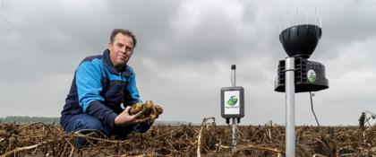 Farmer Jan Straver with the weather station of AgroExact